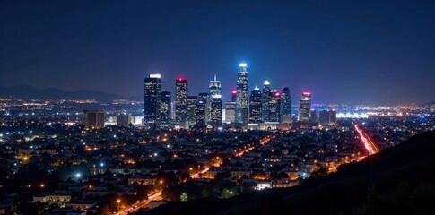 Fototapeta premium Night view of LA's downtown skyscrapers, glittering lights , USA, america