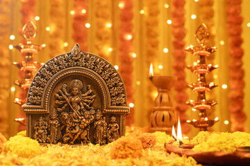 Stunning Goddess Durga with festive marigold flowers and illuminated background.Ideal for Durga Puja, Navratri, Hindu festivals,spirituality, Indian culture, mythology, divine mother, religious events