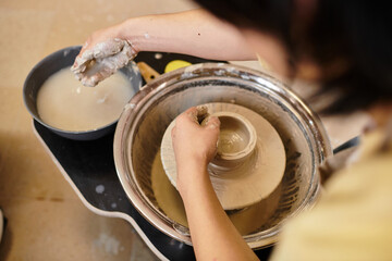 Creating beautiful pottery in a vibrant art studio filled with creativity and passion