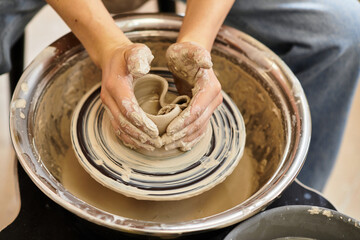 Crafting unique pottery in a vibrant and inviting studio with natural light