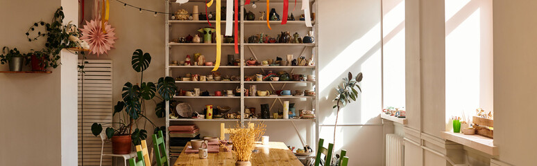 Creative pottery studio filled with artistic tools and elegant designs in warm sunlight