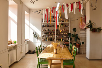 Creative pottery studio with vibrant decor and natural light fostering artistic expression