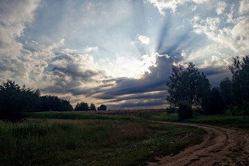 Dirt road in the countryside on a cloudy day