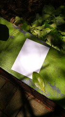 plain a4 poster paper mockup with green nature outdoor background