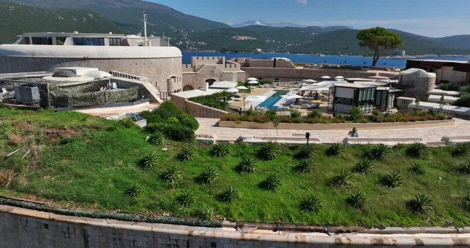 Mamula Fortress and luxury hotel on Mamula Island, Montenegro. Ascending backward drone aerial