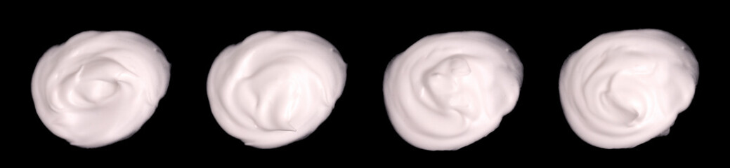 Obraz premium Set of white cosmetic cream samples isolated on black background. Cosmetic cream traces, skin care lotion.