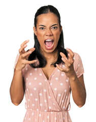 Young Filipino woman in studio screaming with rage.