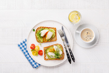 Delicious avocado toasts topped with perfectly cooked poached eggs