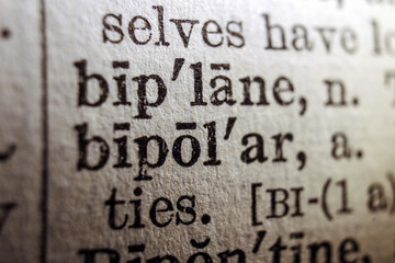 Obraz premium Word bipolar printed on dictionary page, macro, close up