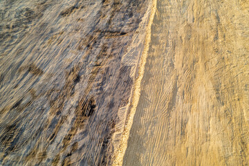 aerial perspective of earth surface with tire tracks