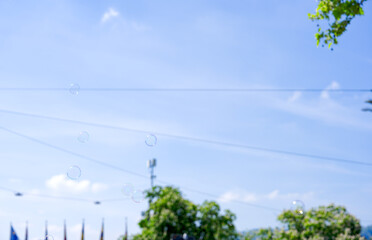 Soap bubbles in the air at Swiss City of Zürich at town square named Bellevue on a sunny spring day. Photo taken April 28th, 2025, Zurich, Switzerland.