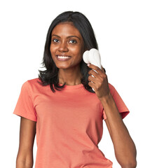 Young Indian woman with facial cleanser happy, smiling and cheerful.