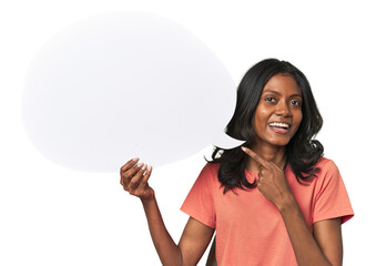 Indian woman with dialogue bubble smiling and pointing aside, showing something at blank space.