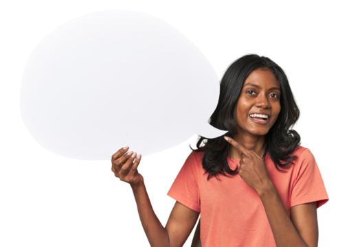 Indian woman with dialogue bubble smiling and pointing aside, showing something at blank space.