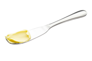 Creamy butter spread on a silver butter knife isolated on white background perfect for culinary