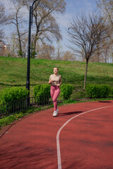 Woman Jogging on Outdoor Track
