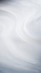 Obraz premium A tranquil and abstract representation of soft waves and textures in white. Ideal for minimalist design projects.