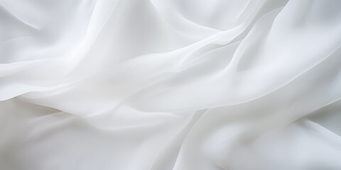 Obraz premium Elegant white fabric draped softly, creating a serene and tranquil atmosphere for decor or fashion.