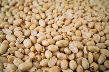 Peeled peanuts arranged as natural background for your banner, advertisement or design.