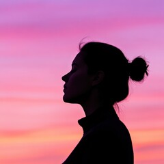 Woman silhouette against colorful sunset