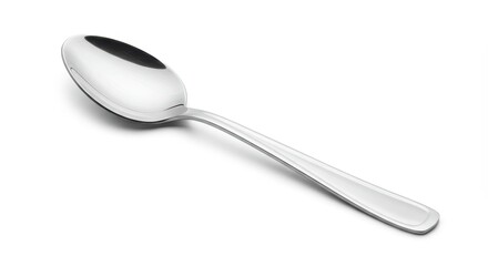 A shiny silver spoon lying diagonally on a white surface casting a subtle shadow underneath it