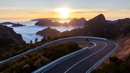 Motorcycle Driver Riding in High Mountain Landscape. Pico do Arieiro, Madeira Island.