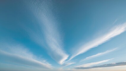 Clouds drifting in a blue sky