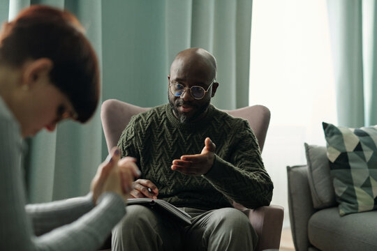 African American Psychologist Talking to Patient