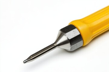 Close up of a yellow handled precision tool detailed metal tip sharp point isolated on white