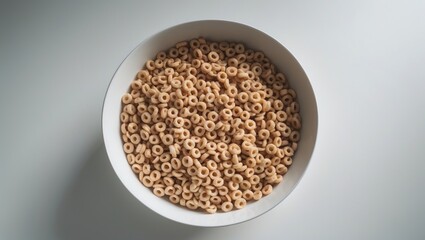 Honey Cheerios in a bowl, isolated on a white surface