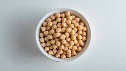 Bowl with preserved chickpeas placed on a background