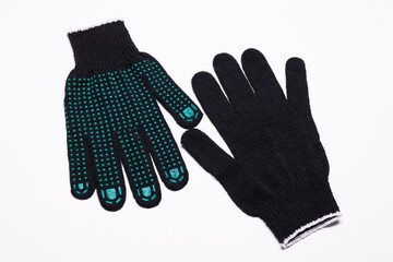 Pair of black work gloves with green rubber grip dots, front and back view on white background