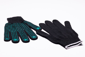 Pair of black work gloves with green rubber grip dots, front and back view on white background