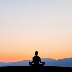 Obraz premium Meditating silhouette at sunset