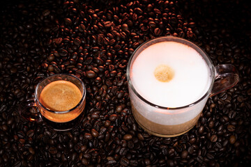 Glass Cups of Espresso and Cappuccino on Roasted Coffee Beans with Morning Window Light – Coffee Photography Featuring Fresh Brewed Coffee Styles