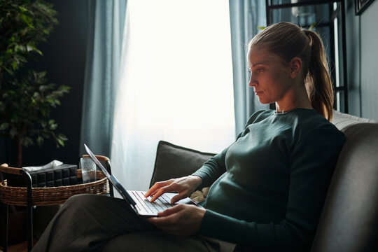 Psychologist Typing on Laptop in Office