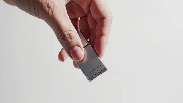 Hand Holding Compact Silver USB Storage Device