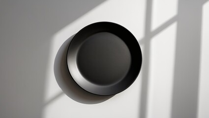 White ceramic round plate without contents, featuring shadow and clipping path