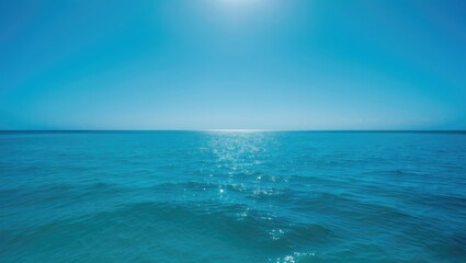 Obraz premium Morning landscape with a vertical perspective of the serene blue sea and sky in a tropical setting