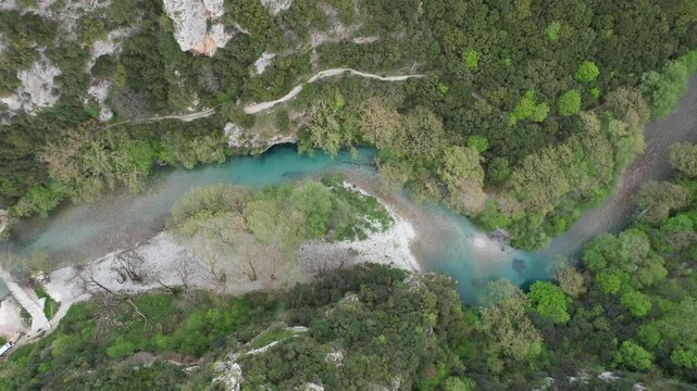Aerial footage of Konitsa and the old bridge in Aoos river in Pindos Mountains in Epirus, Greece 
