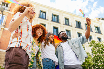 Group of friends celebrating lgbt pride month in the city