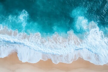 Stunning aerial view of turquoise ocean waves crashing on a pristine sandy beach with a vibrant tranquil seascape