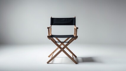 Fototapeta premium Vacant director's chair set against a white background. Text space provided. Empty seat. The theme of casting and selection.