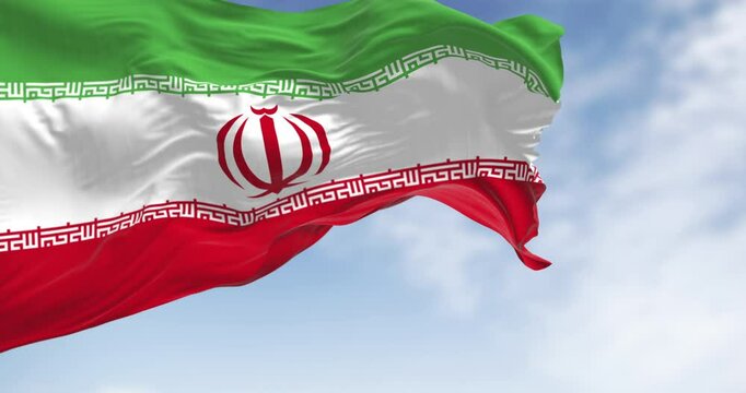 Iran national flag waving outdoors on blue sky. Seamless 3d render animation