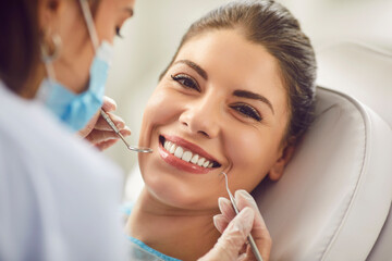 Beautiful happy smiling woman during dentist exam, teeth, gums, dental care female healthy clean...