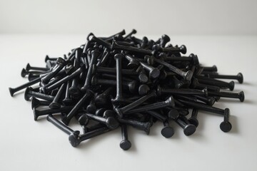 Pile of black tacks on white