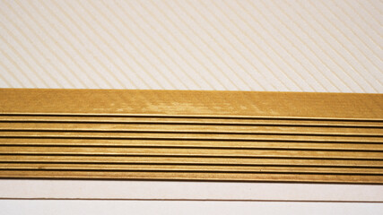 Intricate folds of elegant paper layered with gold