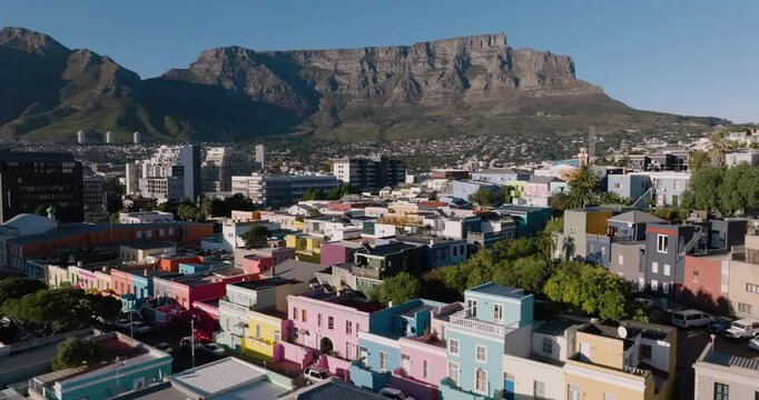 Aerial close-up view of the popular historic tourist destination of the vibrant, colourfull houses in Bo-Kaap (Cape Malay Quarter) in Cape Town.  Lions Head mountain in the background. 