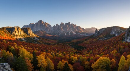 Fototapeta premium Epic fall panorama where peaks meet colorful woods