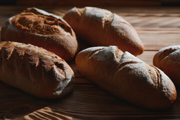 Freshly baked sourdough bread with a golden crust on bakery shelves. Baker shop context with delicious bread